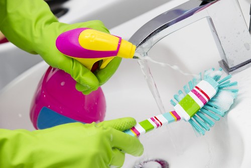 Office cleaner maintaining a Barnes workplace reception area